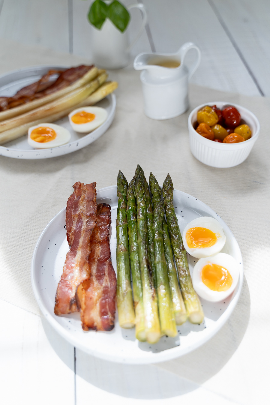 Asparagus, bacon and soft eggs on speckled plates — Green Kitchen