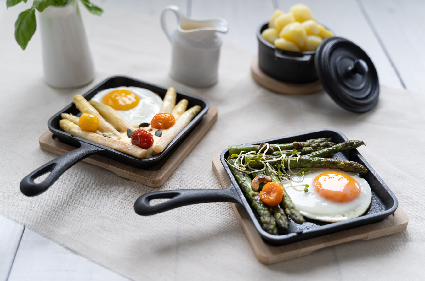 Two skillets with asparagus and egg overhead — Green Kitchen