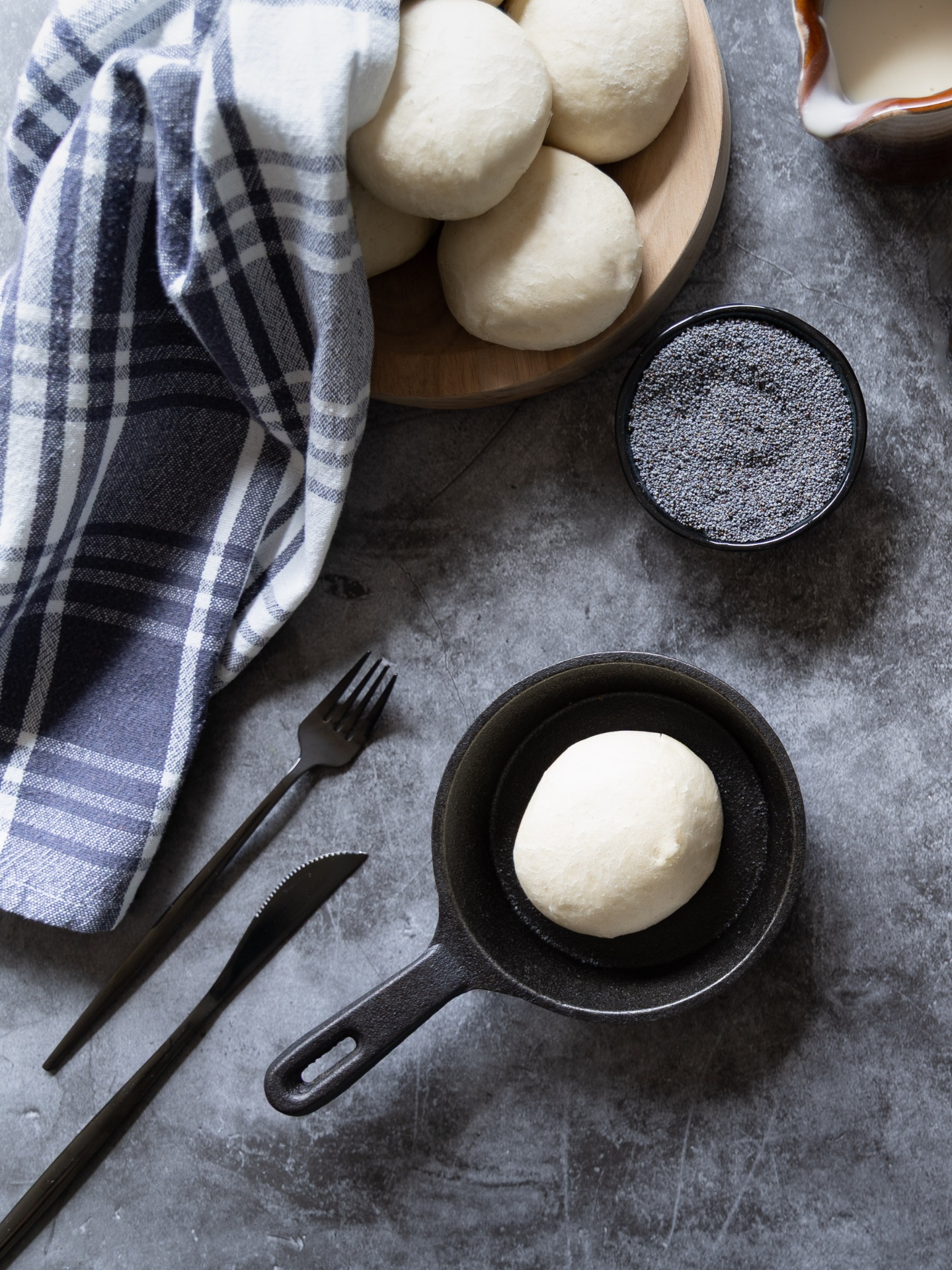 Skillet dumpling with linen and forks — Poppy Seed Dumplings
