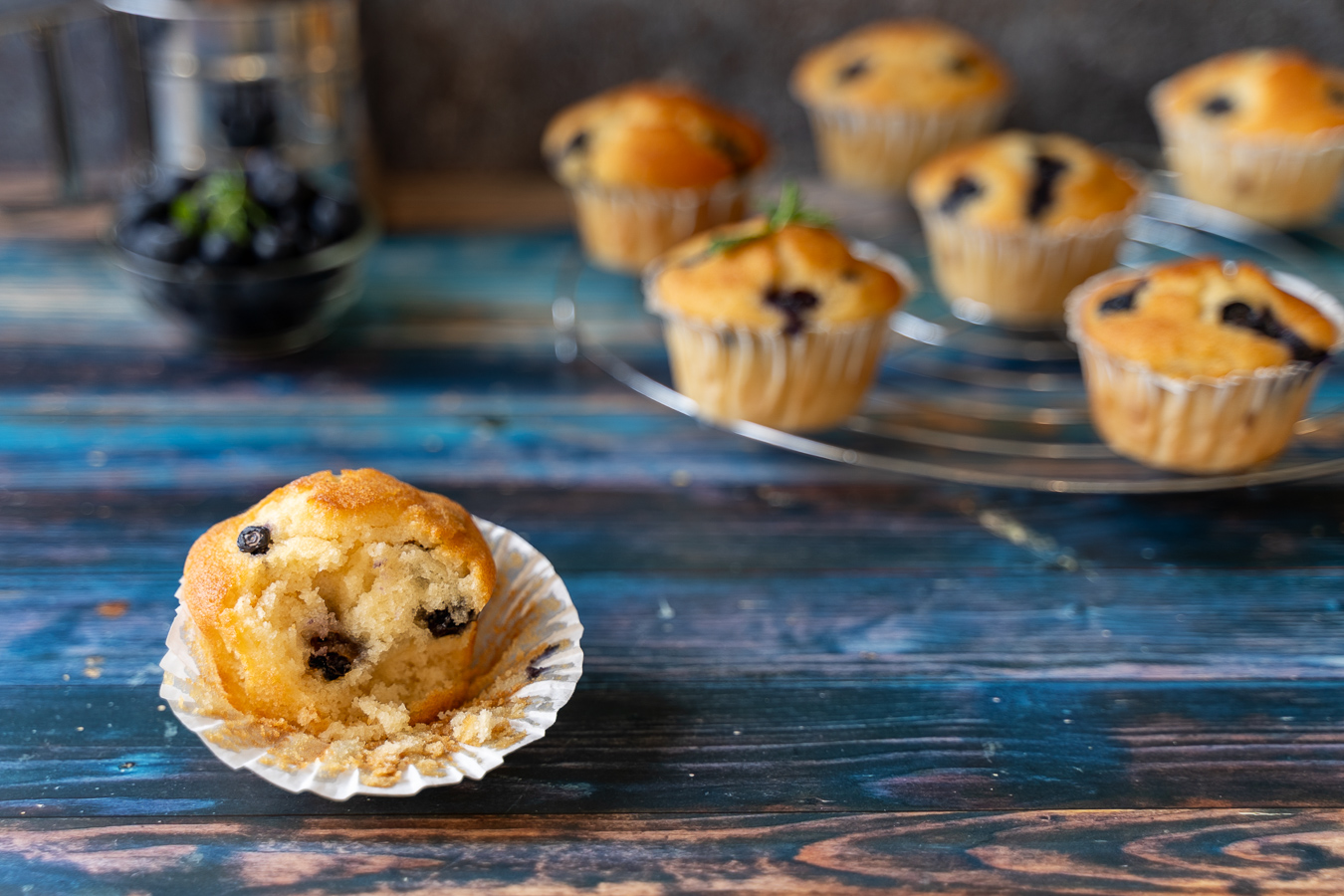 Blueberry muffin on blue wood — Bakery Notes