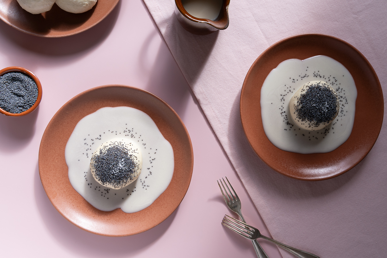 Two terracotta plates with dumplings — Poppy Seed Dumplings